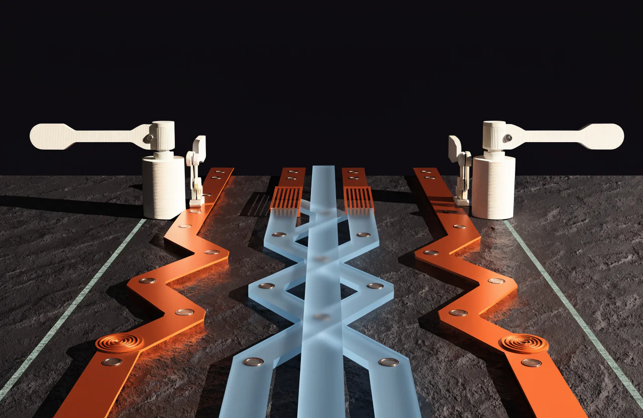 A physical system sculpture of parallel orange and blue paths passing through controlled mechanical gates.