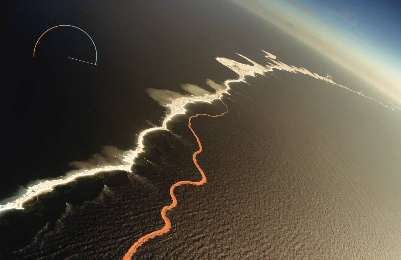 Aerial view of the Florida Keys crossed by a precise orange route line.